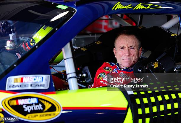 Mark Martin, driver of the Kellogg's/CARQUEST Chevrolet, waits in his car during practice for the NASCAR Sprint Cup Series Pepsi 500 at Auto Club...