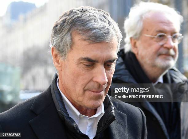 French former budget minister Jerome Cahuzac , flanked by his lawyer Jean-Alain Michel arrives at the Paris courthouse for his appeal trial on tax...