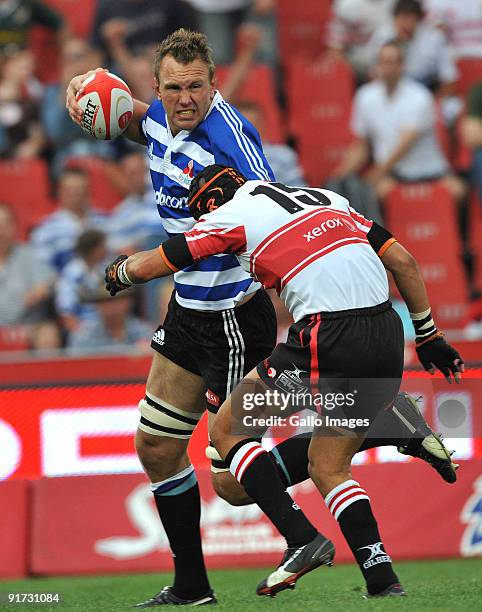 Andries Bekker of Western Province tackled by Earl Rose of the Lions during the Absa Currie Cup match between Xerox Lions and Western Province from...