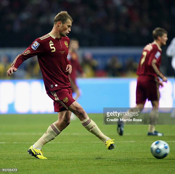 Vasily Berezutsky of Russia runs with the ball during the FIFA 2010 World Cup Group 4 Qualifier match between Russia and Germany at the Luzhniki...
