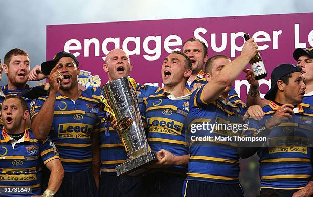 Kevin Sinfield of Leeds Rhinos celebrates with the trophy and team mates during the Engage Super League Grand Final between Leeds Rhinos and St...