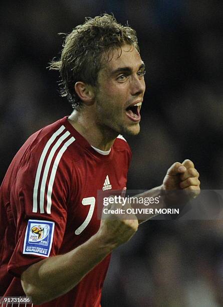 Denmark's Jacob Poulsen celebrates after winning the World Cup 2010 qualifying match against Sweden on October 10, 2009 at the Parken Stadium in...