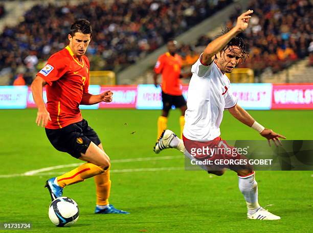 Belgian's Kevin Mirallas vies for the ball to Turkey's Gokhan Gonul during their World Cup 2010 qualifying football match in Heysel stadium in...