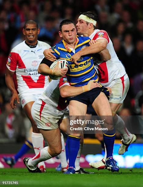 Kevin Sinfield of Leeds Rhinos holds off the St Helens defence during the Engage Super League Grand Final between Leeds Rhinos and St Helens at Old...