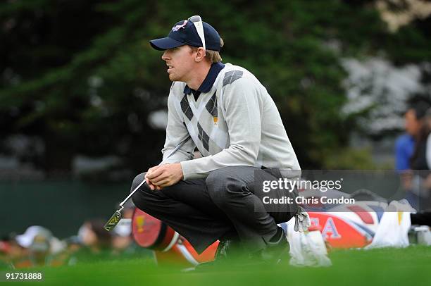 Hunter Mahan of the U.S. Team lines up a putt on during the third round morning foursome matches for The Presidents Cup at Harding Park Golf Club on...