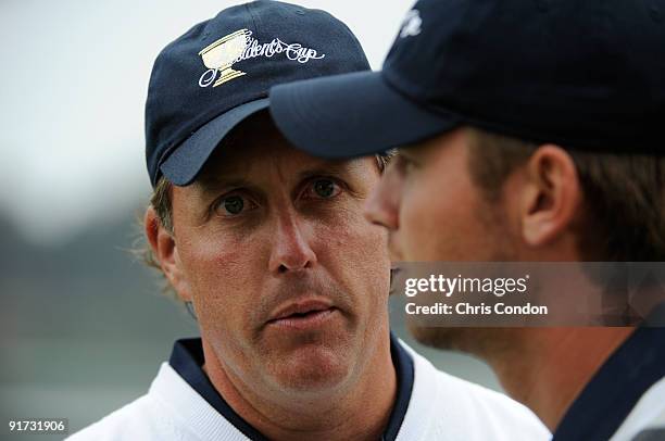 Phil Mickelson of the U.S. Team talks to partner Sean O'Hair during the third round morning foursome matches for The Presidents Cup at Harding Park...