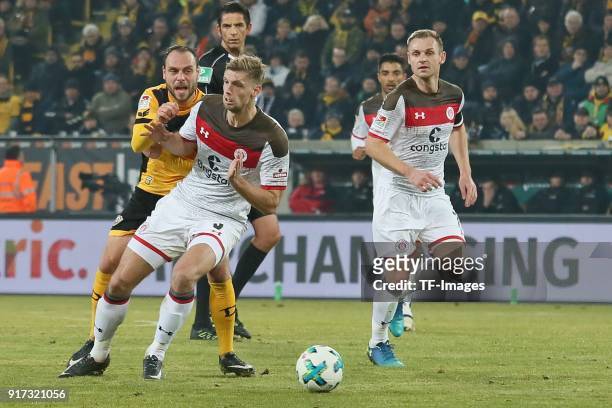 Rico Benatelli of Dresden, Lasse Sobiech of St. Pauli and Bernd Nehrig of St. Pauli battle for the ball during the Second Bundesliga match between SG...
