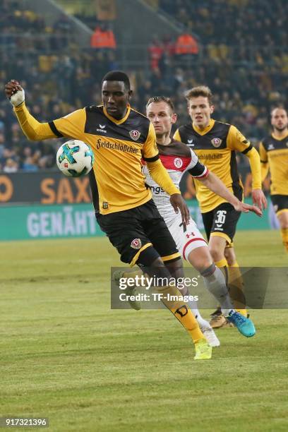 Peniel Mlapa of Dresden, Bernd Nehrig of St. Pauli and Niklas Hauptmann of Dresden battle for the ball during the Second Bundesliga match between SG...