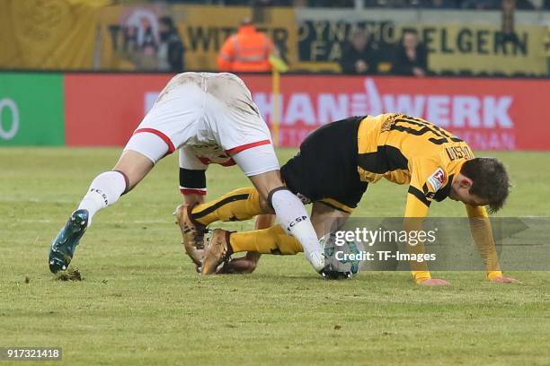 Bernd Nehrig of St. Pauli and Niklas Hauptmann of Dresden battle for the ball during the Second Bundesliga match between SG Dynamo Dresden of St....