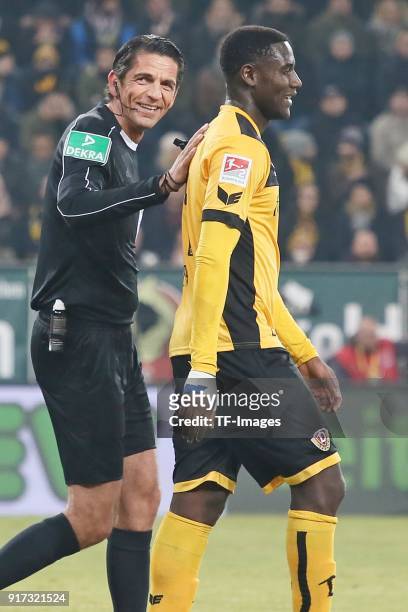 Referee Deniz Aytekin and Peniel Mlapa of Dresden laugh during the Second Bundesliga match between SG Dynamo Dresden and FC St. Pauli at DDV-Stadion...