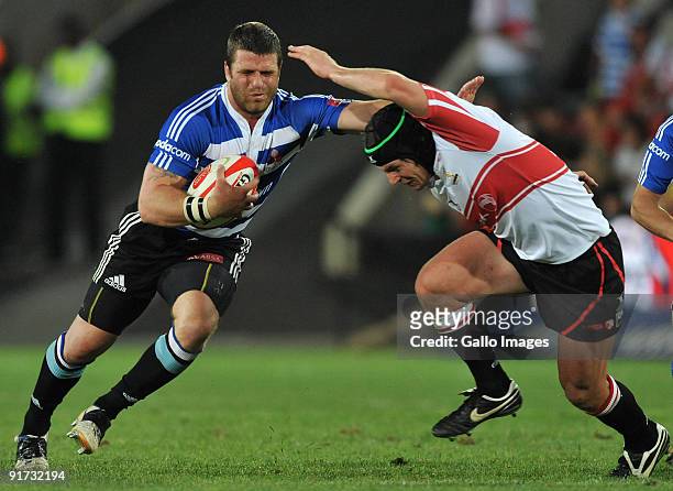 Luke Watson of Western Province tackled by Cobus Grobbelaar of the Lions during the Absa Currie Cup match between Xerox Lions and Western Province...