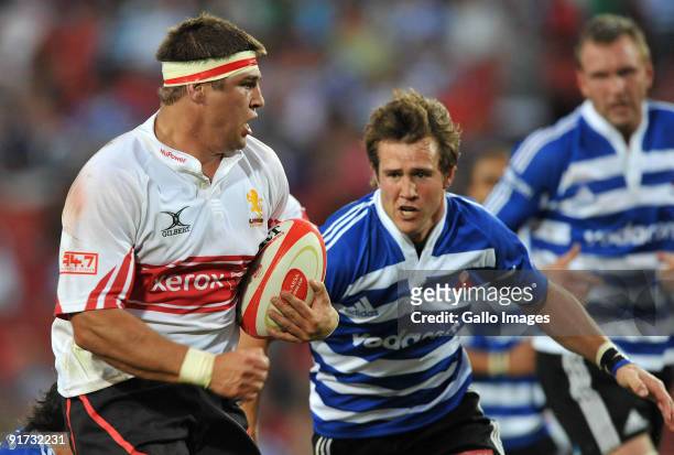 Willem Alberts of the Lions about to be tackled by Peter Grant of Western Province during the Absa Currie Cup match between Xerox Lions and Western...