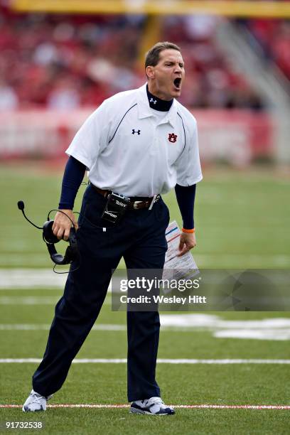 Head Coach Gene Chizik of the Auburn Tigers yells at the referees during a game against the Arkansas Razorbacks at Donald W. Reynolds Stadium on...