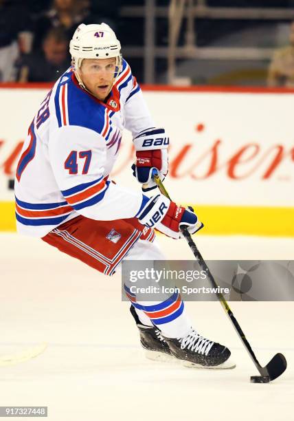 New York Rangers Defenceman Steven Kampfer skates with the puck during a NHL game between the Winnipeg Jets and New York Rangers on February 11, 2018...