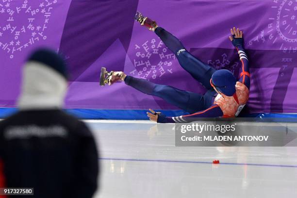 Taiwan's Huang Yu-Ting falls as she competes in the women's 1,500m speed skating event during the Pyeongchang 2018 Winter Olympic Games at the...