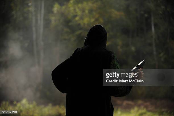 Alex Soballe of Chicago, Ill. Shoots a 9mm handgun at the Knob Creek Machine Gun Shoot on October 10, 2009 in West Point, Kentucky. The Supreme Court...