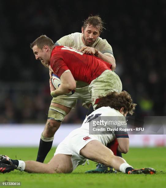 Hadleigh Parkes of Wales is tackled by Chris Robshaw and Alec Hepburn during the NatWest Six Nations match between England and Wales at Twickenham...
