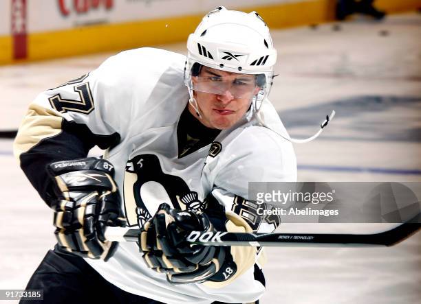Sidney Crosby of the Pittsburgh Penguins shoots during warmup before taking on the Toronto Maple Leafs during a NHL game at the Air Canada Centre on...
