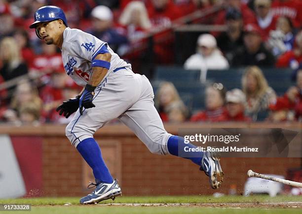 Rafael Furcal of the Los Angeles Dodgers hits an RBI single against the St. Louis Cardinals in the fourth inning of Game Three of the NLDS during the...