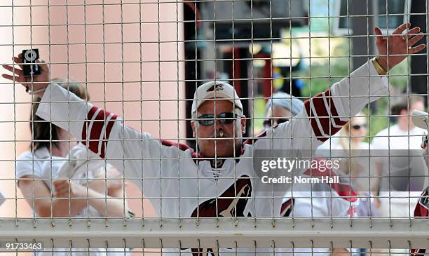 An anxious fan waits for the gates to open to welcome the Phoenix Coyotes back for the 2009-10 season as they take on the Columbus Blue Jackets on...