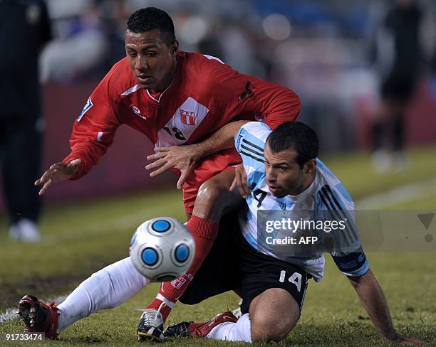 Argentina's footballer Javier Mascherano vies for the ball with Peru's footballer Luis Ramirez during their FIFA World Cup South Africa-2010...