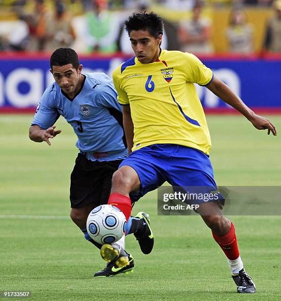 Ecuador's Christian Noboa vies for the ball against Uruguay's Walter Gargano, during their FIFA World Cup South Africa-2010 qualifier football match...