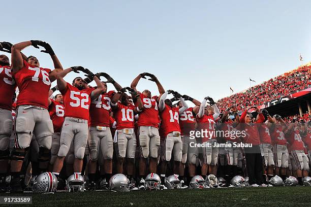 The Ohio State Buckeyes sing their alma mater, Carmen Ohio, after defeating the Wisconsin Badgers 31-13 at Ohio Stadium on October 10, 2009 in...