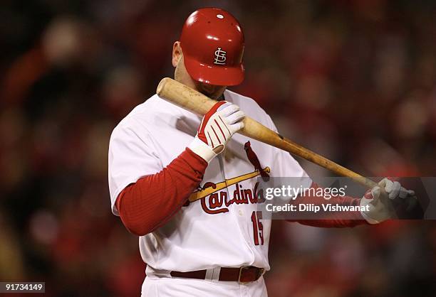 Matt Holliday of the St. Louis Cardinals kisses his bat at home plate in the sixth inning against the Los Angeles Dodgers in Game Three of the NLDS...