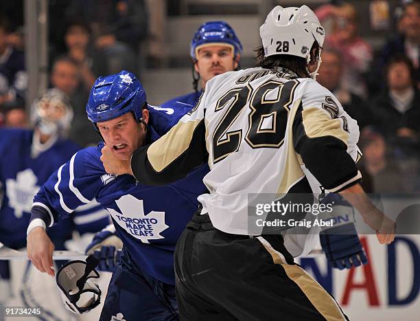 Colton Orr of the Toronto Maple Leafs drops the gloves with Eric Godard of the Pittsburgh Penguins during game action October 10, 2009 at the Air...