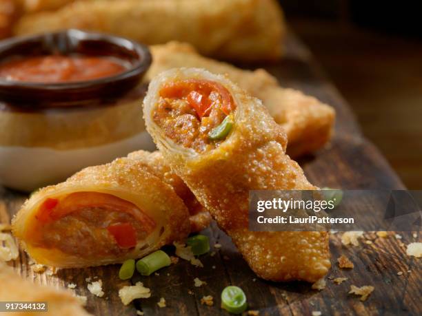 pizza egg rolls with sausage, pepperoni and peppers - beef sausage stock pictures, royalty-free photos & images