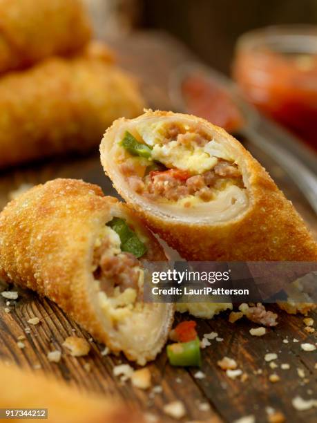 egg and sausage breakfast egg roll - egg roll stock pictures, royalty-free photos & images