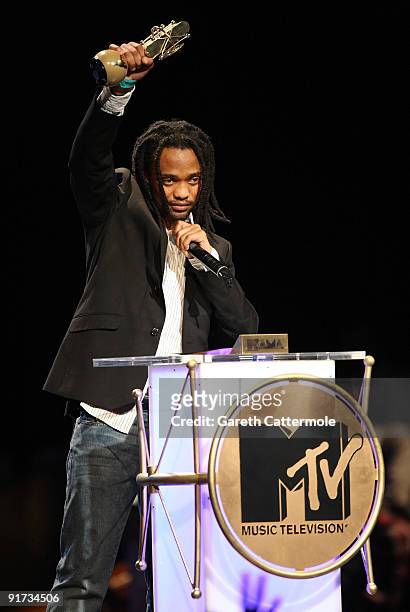 Thokozani Dube accepts the Legend Award won by his late father Lucky Dube at the MTV Africa Music Awards with Zain at the Moi International Sports...