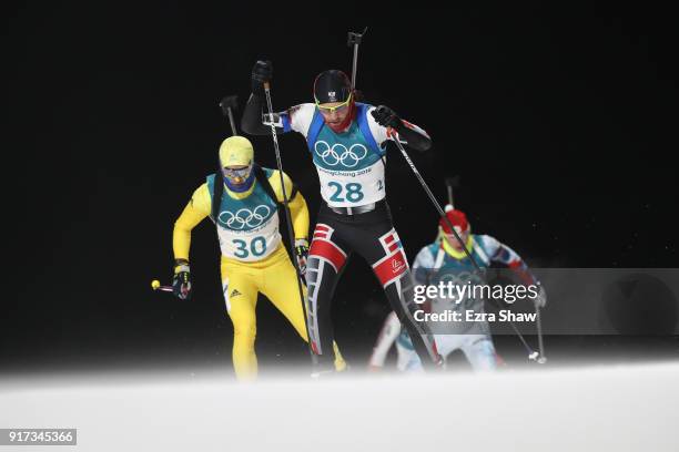 Simon Eder of Austria and Jesper Nelin of Sweden compete during the Men's Biathlon 12.5km Pursuit on day three of the PyeongChang 2018 Winter Olympic...