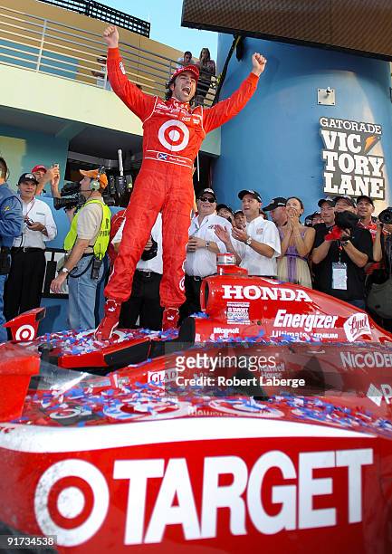 Dario Franchitti driver of the Target Chip Ganassi Racing Dallara Honda celebrates after winning the IRL IndyCar Series Firestone Indy 300 and the...