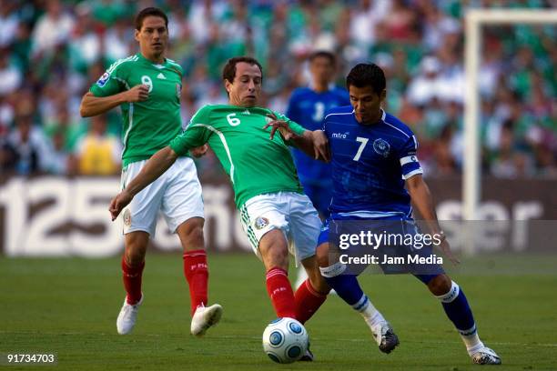 Ramon Sanchez of El Sanvador vies for the ball with Mexicos' Guillermo Franco , Gerardo Torrado during their 2010 FIFA World Cup qualifying at the...