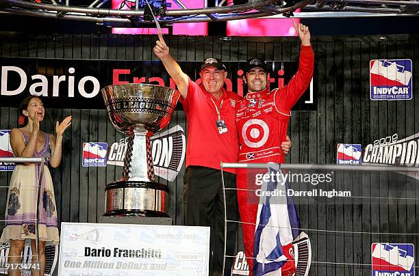 Dario Franchitti, driver of the Target Chip Ganassi Racing Dallara Honda celebrates winning the IndyCar Series Championship with his father George as...