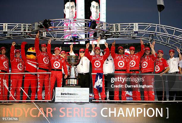 Dario Franchitti, driver of the Target Chip Ganassi Racing Dallara Honda and team owner Chip Ganassi celebrates with the team after winning the...