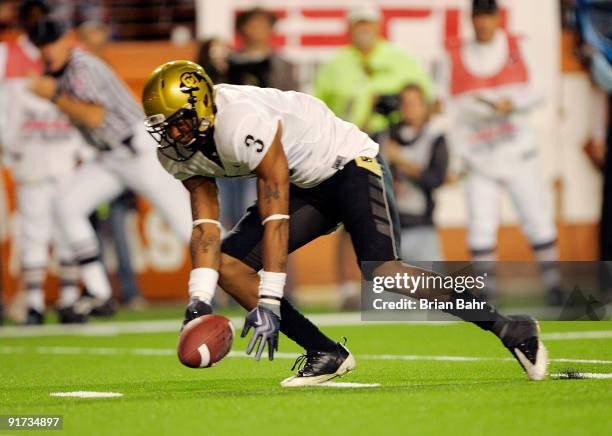 Cornerback Jimmy Smith of the Colorado Buffaloes picks up the loose ball which was knocked out of the hand of quarterback Colt McCoy of the Texas...
