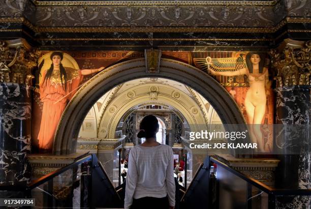 Visitor, standing on a suspended bridge, twelve metres above ground, looks at paintings by Austrian painter Gustav Klimt which adorn the arches of...