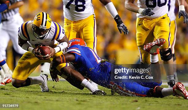 Jones of the Florida Gators tackles quarterback Jordan Jefferson of the Louisiana State University Tigers at Tiger Stadium on October 10, 2009 in...