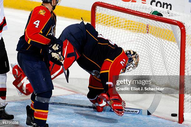 Goaltender Tomas Vokoun of the Florida Panthers lets a goal slip through shot by David Clarkson of the New Jersey Devils at the Bank Atlantic Center...