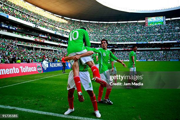 Cuauhtemoc Blanco and Guillermo Franco of Mexico celebrate scored goal during a match against El Salvador as part of the FIFA 2010 World Cup...