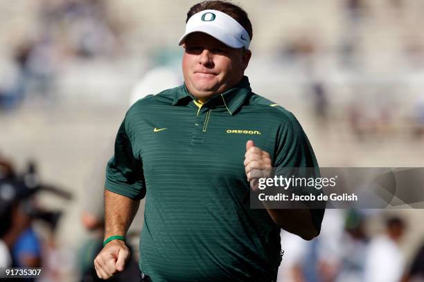 Chip Kelly Head Coach of the Oregon Ducks runs back to the locker room after they beat the UCLA Bruins 24-10 on October 10, 2009 at the Rosebowl in...