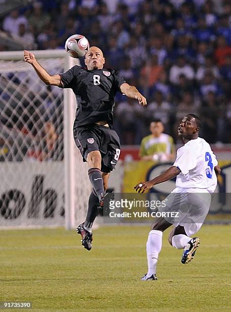Conor Casey of the US vies with Honduran Mynor Figueroa during their FIFA World Cup South Africa 2010 Concacaf qualifier football match at Olimpico...