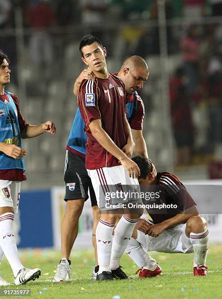 Players of Venezuela react in lament after losing their match against Paraguay as part of the 2010 FIFA World Cup qualifying at the Cachamay Stadium...