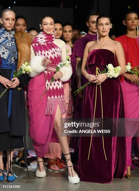 Models Gigi Hadid and Bella Hadid pose at the end of the runway for Prabal Gurung during New York Fashion Week: The Shows at Gallery I at Spring...