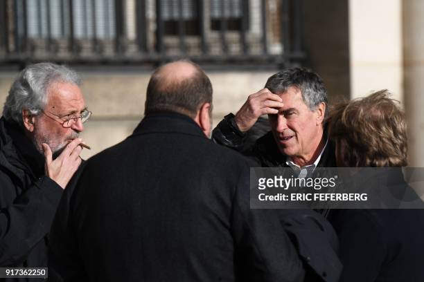 French former budget minister Jerome Cahuzac , speaks with this by his lawyers Jean-Alain Michel and Eric Dupond-Moretti as they leave the Paris...