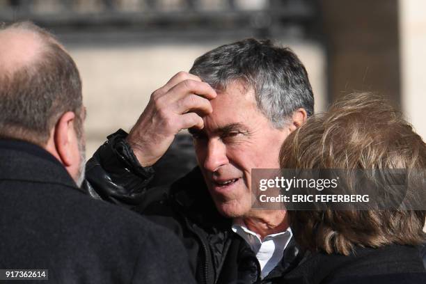 French former budget minister Jerome Cahuzac speaks with his lawyer Eric Dupond-Moretti as they leave the Paris courthouse during his appeal trial on...