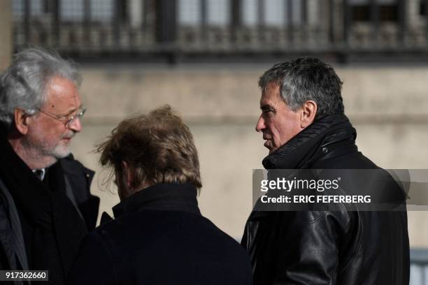 French former budget minister Jerome Cahuzac speaks with his lawyer Jean-Alain Michel as they leave the Paris courthouse after a hearing in his...