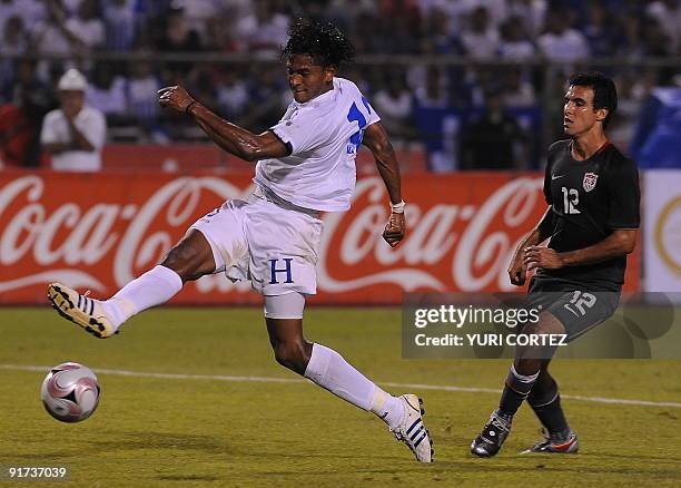 Jonathan Bornstein vies with Honduran Carlo Costly during their FIFA World Cup South Africa 2010 Concacaf qualifier football match at Olimpico...